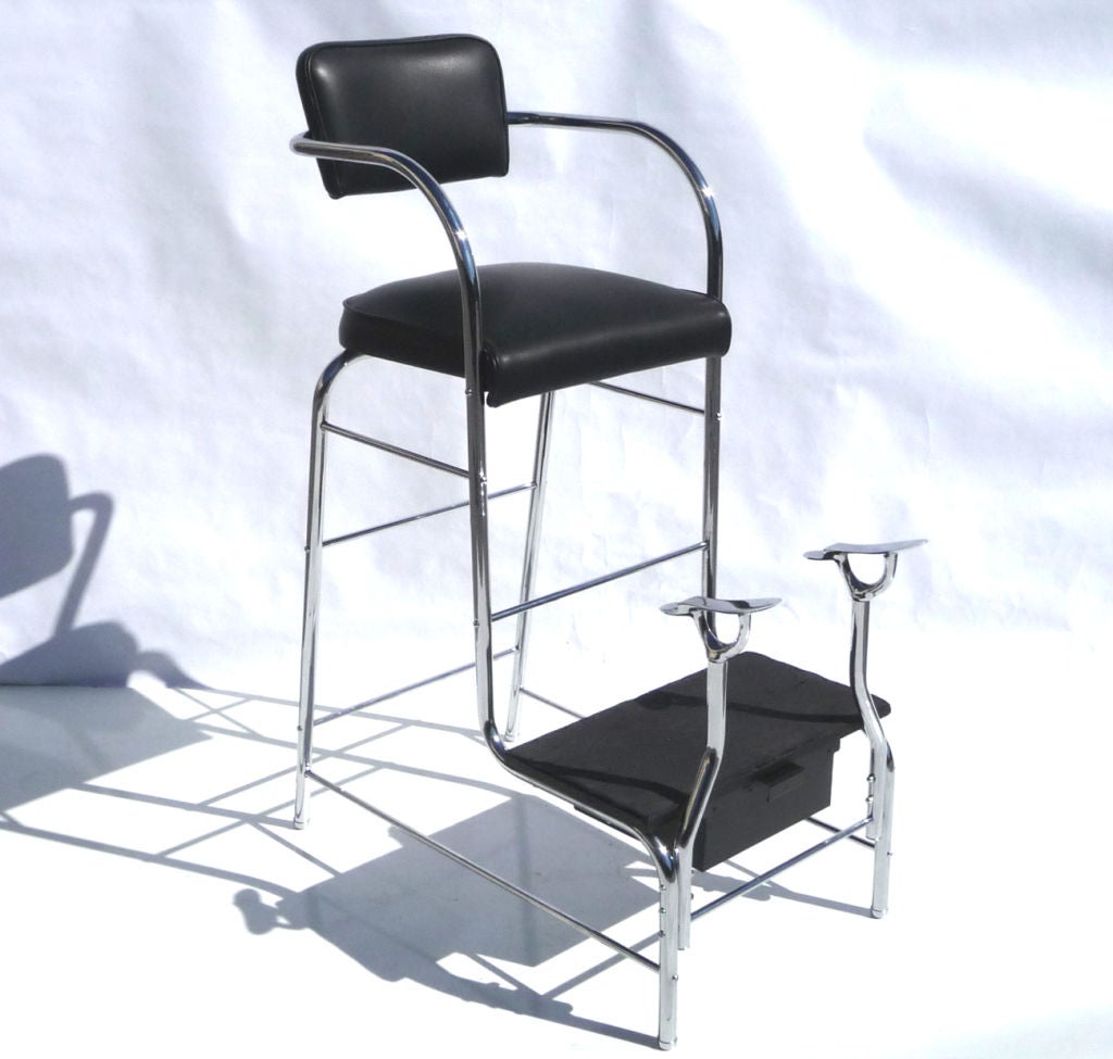 Form meets function seamlessly in this stylish stand. While most shoe shine stands are heavy, boxy affairs, ours is light and seemingly transparent. All metal tubes have been re-chromed, and the seat has been reupholstered in new black leather. A