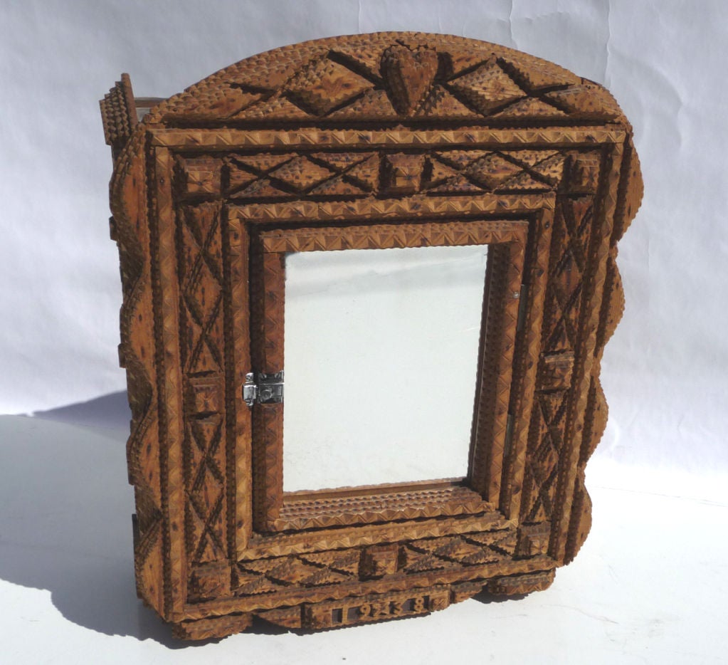 RETIREMENT SALE!!!  EVERYTHING MUST GO - CHECK OUT OUR OTHER ITEMS.				

Ultra charming and well executed, this cabinet is even dated 1938 on the bottom of the face. All visible surfaces are carved diamond and star patterns, with a central heart, in