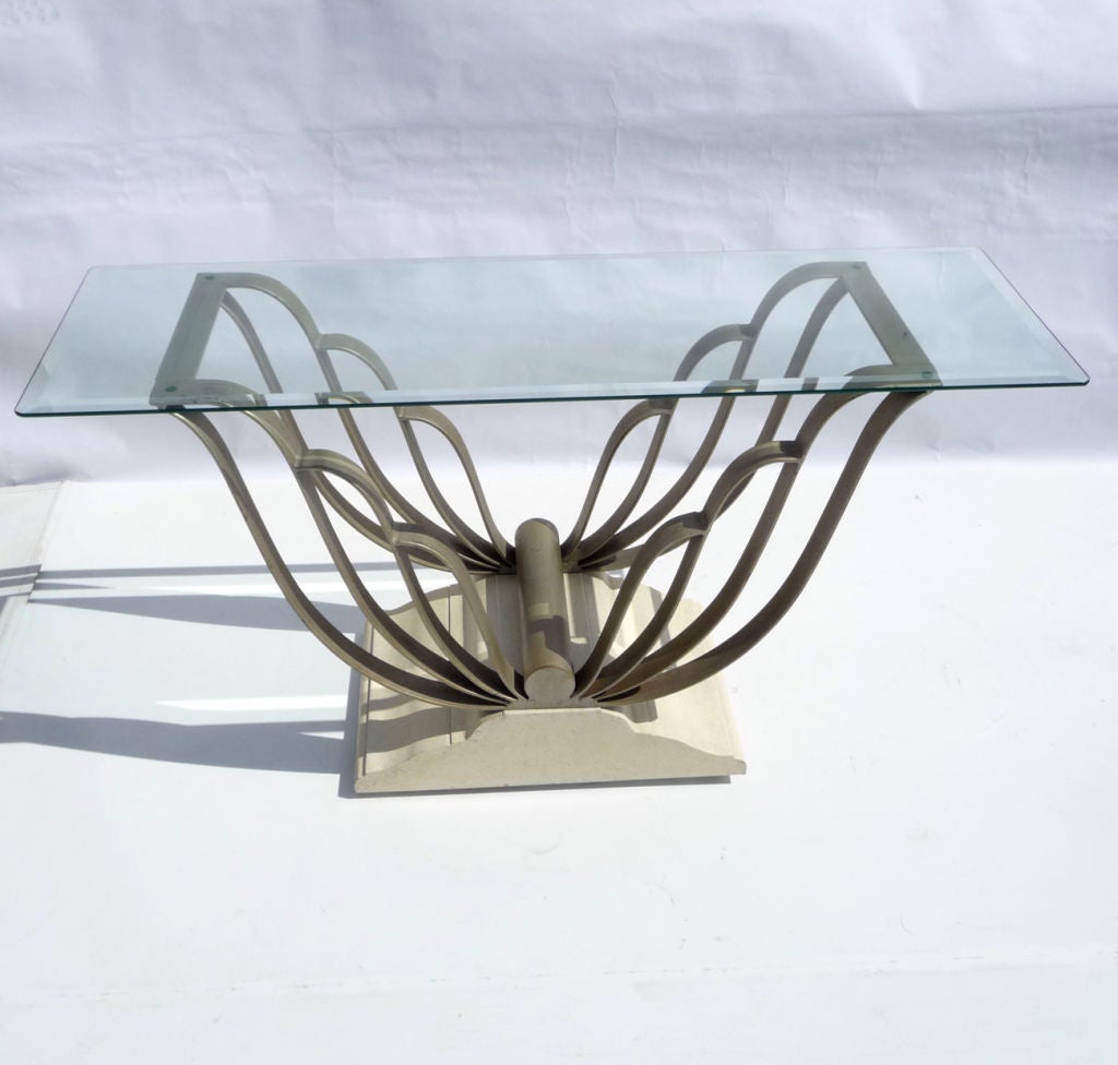 A lovely, graceful design which evokes butterfly wings in painted iron. The base is solid cream painted wood. All surfaces show a wonderful patina of age, and display beautifully. Top surface is a thick beveled glass with softened corners. We also