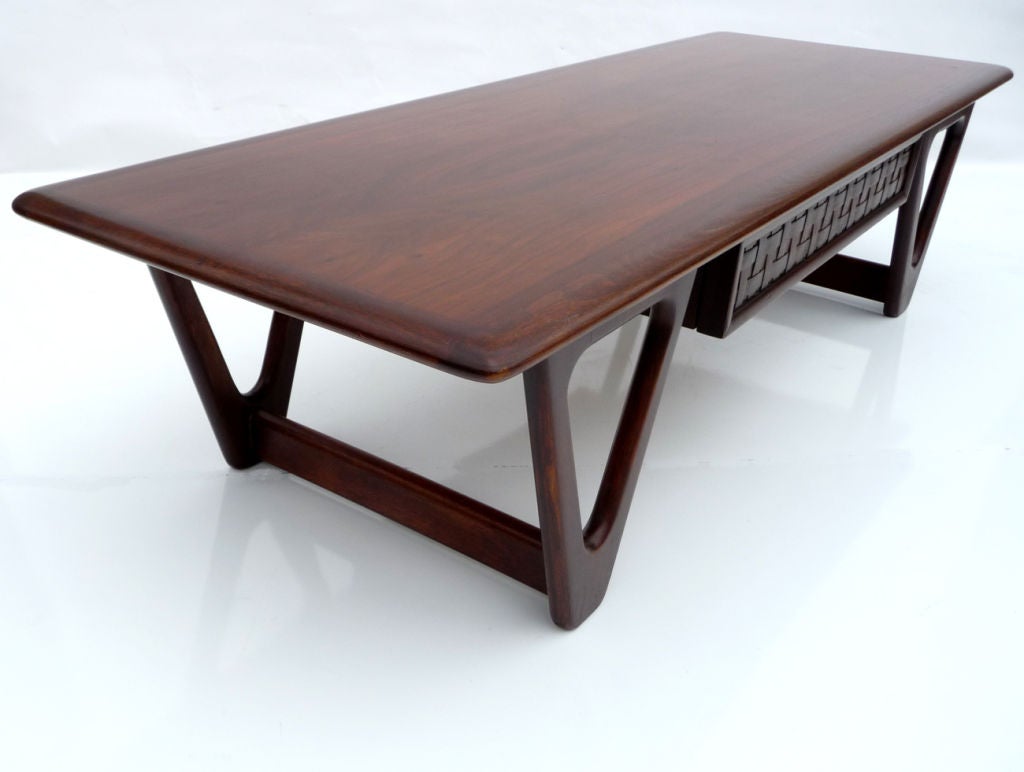 Responding to the wave of great design coming from Denmark, the American based Lane Furniture Company created some of the more iconic furniture designs of the period. Our streamlined table, designed by Warren Church as part of the Perception Line