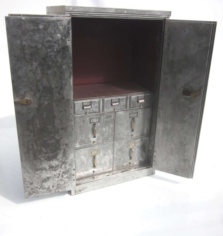 This stunning cabinet can be used as a safe, or double as a bar cabinet or television cabinet. The painted surfaces have been stripped of paint, and brush polished to a fantastic finish. The combination lock is working, allowing you to secure any