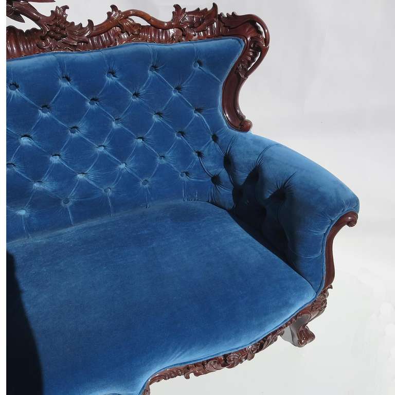 antique sofa with carved eagle