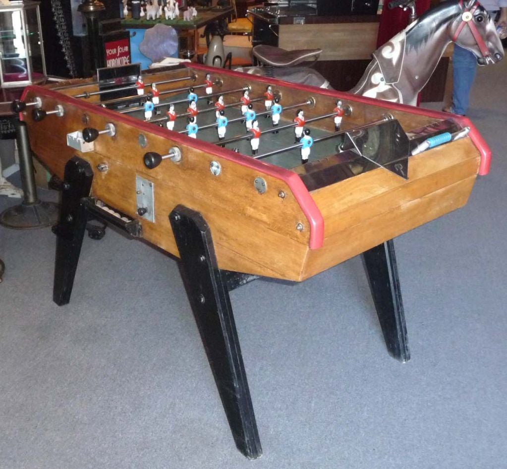 Description: With the worldwide popularity of soccer, these early Foosball, or 
