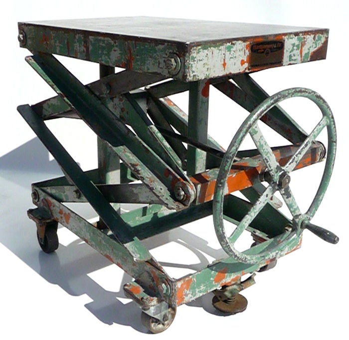 What a fantastic table! We have seen many re-purposed factory tables lately, but none as striking as this one! Multiple colored coats strip away to reveal the strength of design. Features are a step down floor grip, steel wheels, original label, and