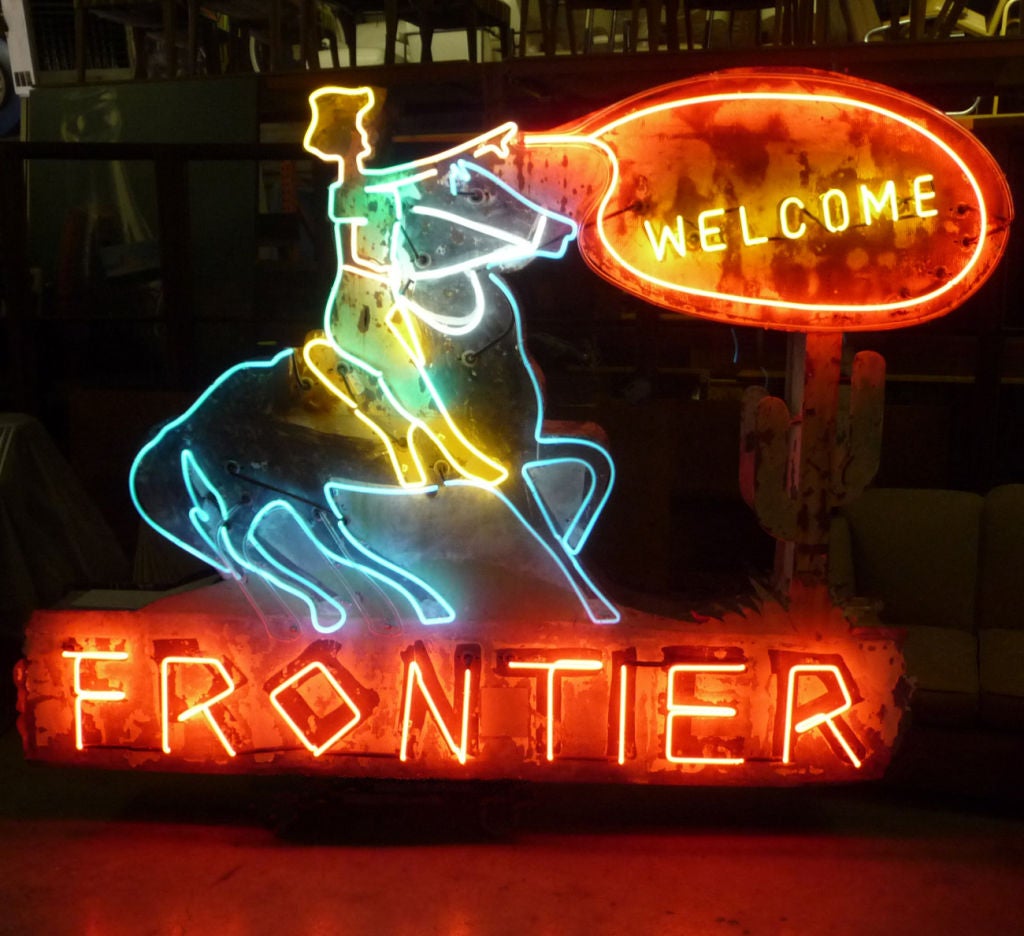 As one was wearily driving down a dark highway, this glowing beacon certainly was a welcoming sight. The lasso and rear horse legs both have motion, created by a blinking between two sets of neon tubes. The horse legs go forward and back, while the