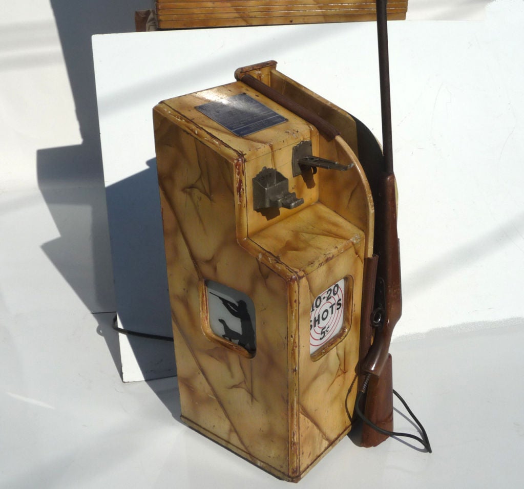 Although the name Seeburg is more closely associated with jukeboxes, they were actually the first to develop and market light activated gun games. Beginning in 1936 with a flying duck, they added a moving bear, raccoon, and eventually human targets.