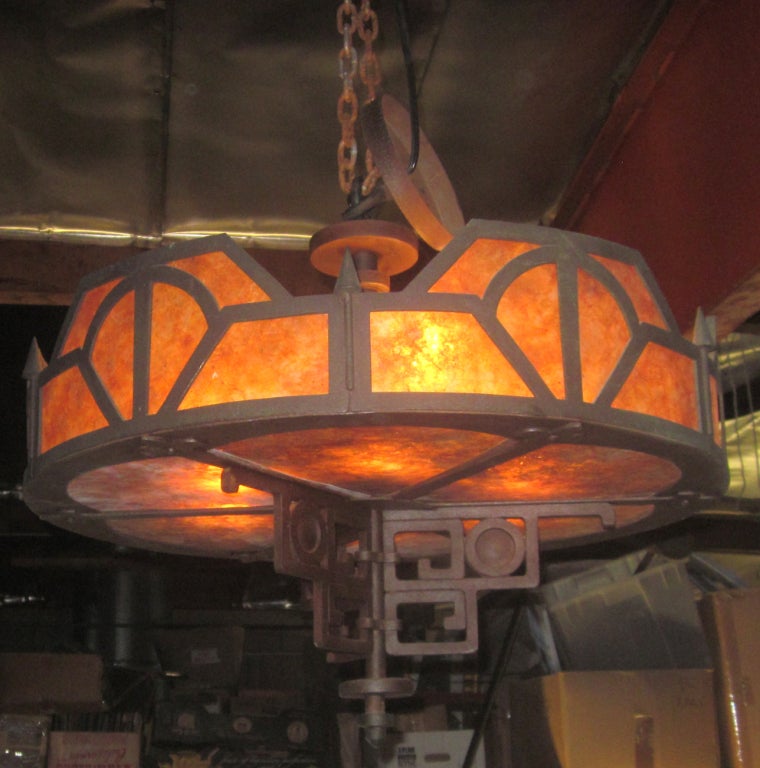 This is one of the best we have seen in this style! The solid chandelier is imposing and masculine, while exuding a warm presence. All mica panels are original, and in good, unbroken condition. The fixture has six lights, plus an 