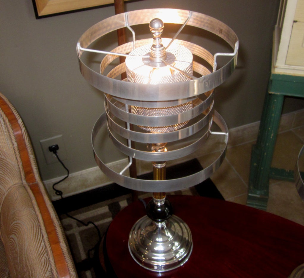 Similar in design to the iconic Walter Von Nessen table lamp for Pattyn Products, these are European made, and presumedly French. They have been restored, and have new black silk cords and plugs. The inner shade is perforated steel, painted in