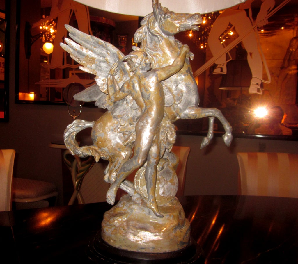 Emile-Louis Picault,  (1833-1915) is best known for his sculptures of mythical and historical figures. Ours depicts Perseus, with the head of the Gorgon Medusa, taming a rearing Pegasus. The spelter painted sculpture is converted to a table lamp