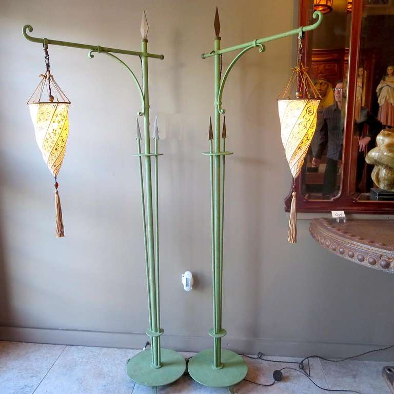 These lovely lamps date back to the 1920's - 1930's era. We have dome some freshening to the rustic finish, where there was some paint loss. We married a great pair of Fortuny silk shades we had, and they now compliment beautifully. New silk cord