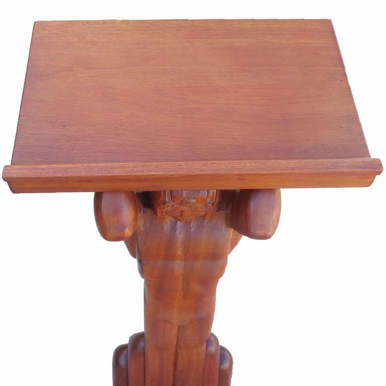 Instead of holding up the world, Atlas proudly lends his support to your podium top! This could have originated as a world encyclopedia stand, or held a world Atlas. The figure and table top are solid mahogany, and finished in a soft satin sheen.