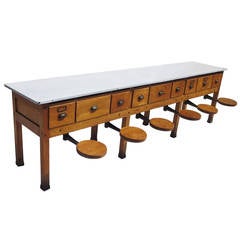 Early 20th Century Institutional Work Table with Pull-Out Seats