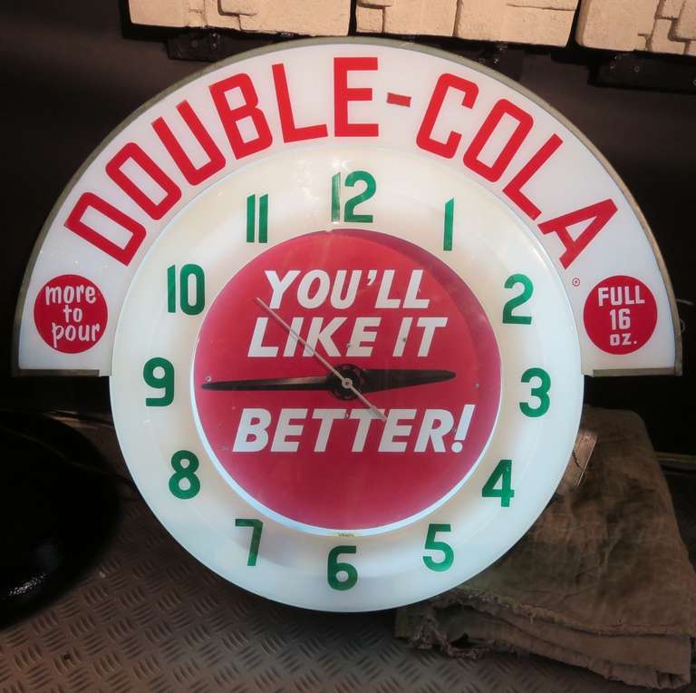 This clean and colorful clock was supplied by a local distributor to hang in a market to advertise their Double Cola product. As the Double Cola company was much smaller compared to the giant Coca Cola or Pepsi Cola company, far fewer of these
