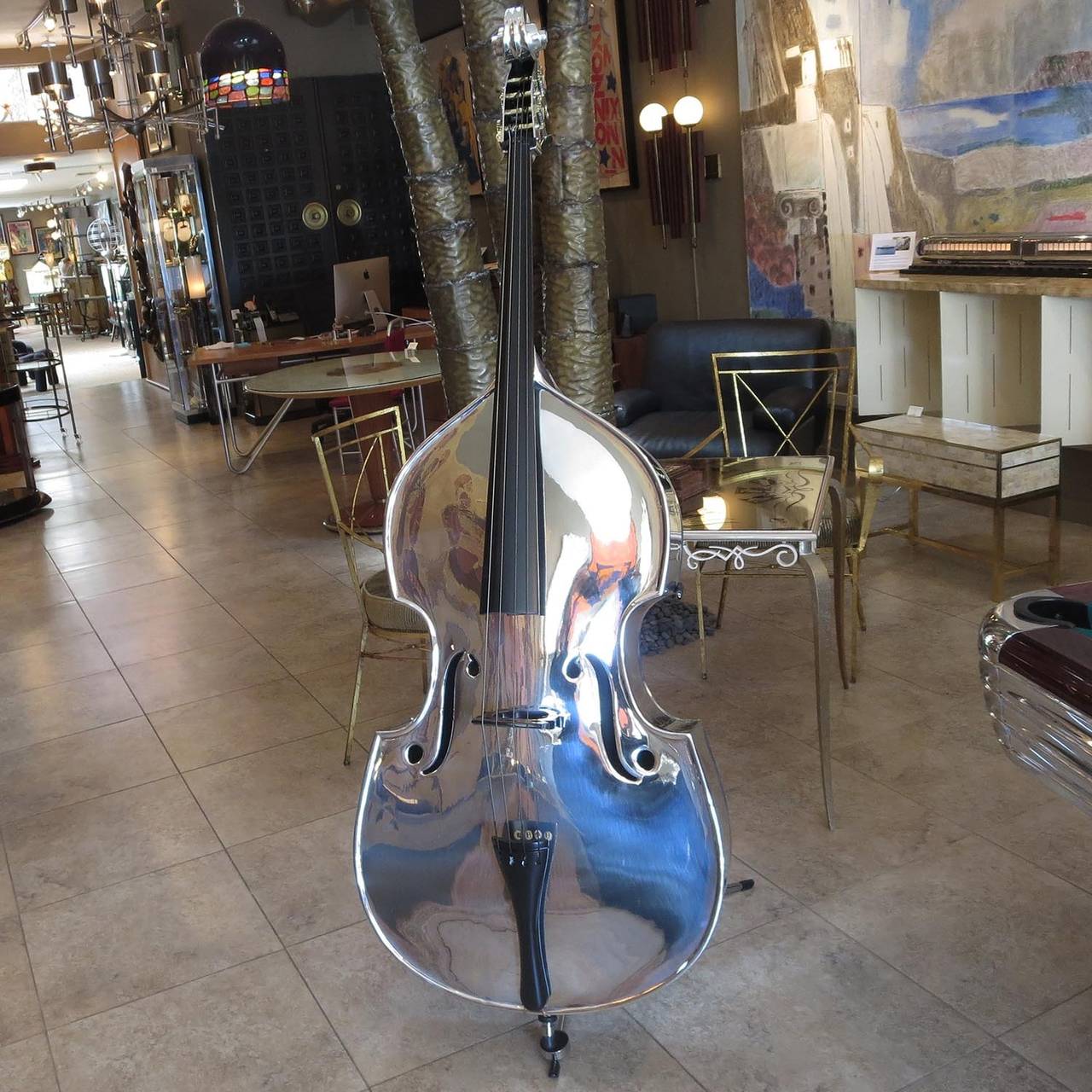 This unbelievable instrument was designed (along with an aluminum violin) by John Burdick, an engineer with Alcoa Aluminum. They were created for use on cruise ships and in limited numbers for student orchestras. Most of the examples found have a