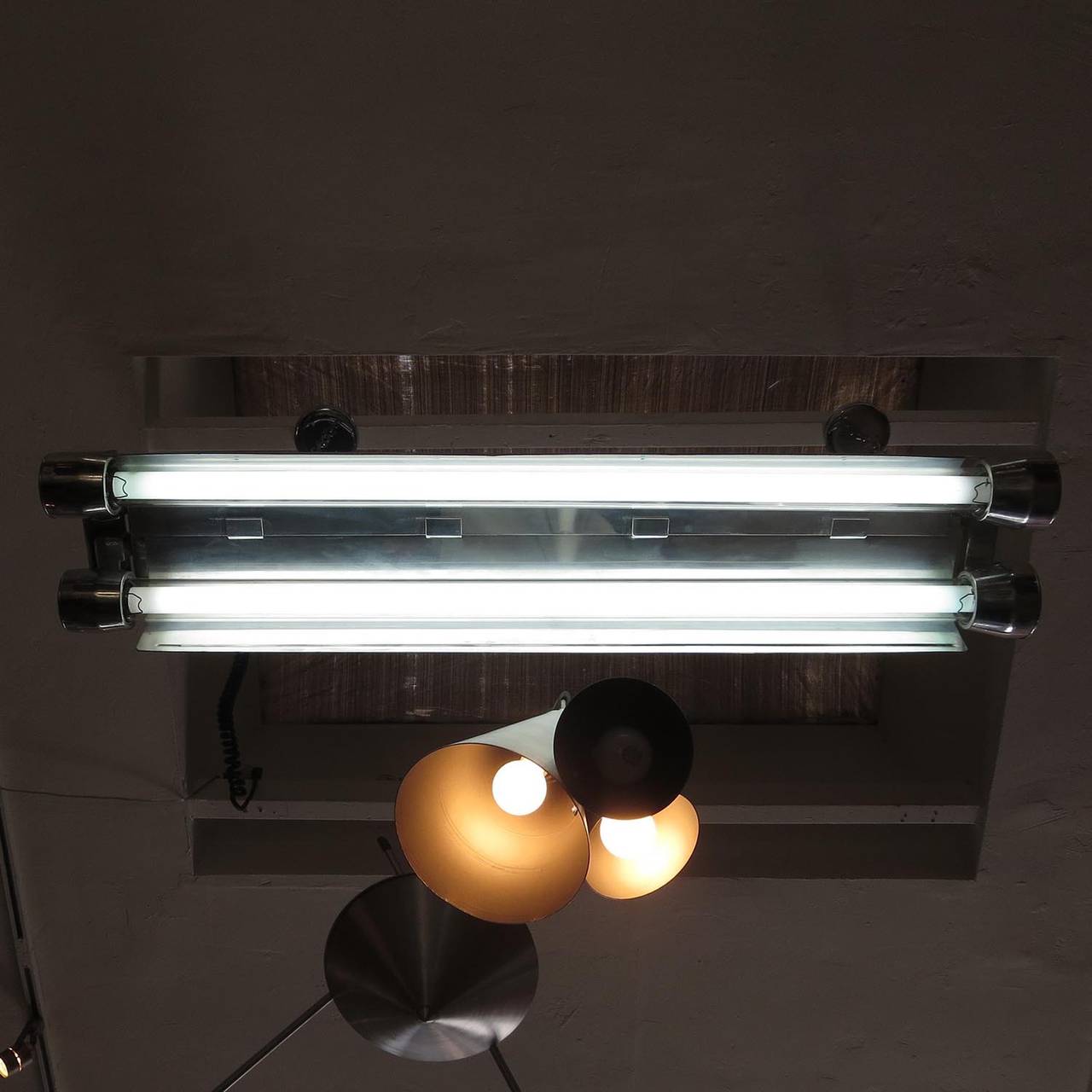 The ultimate in Industrial lighting! This Crouse Hinds lamp was designed for naval use, and made to withstand the most intense conditions. The two fluorescent tubes are surrounded by 