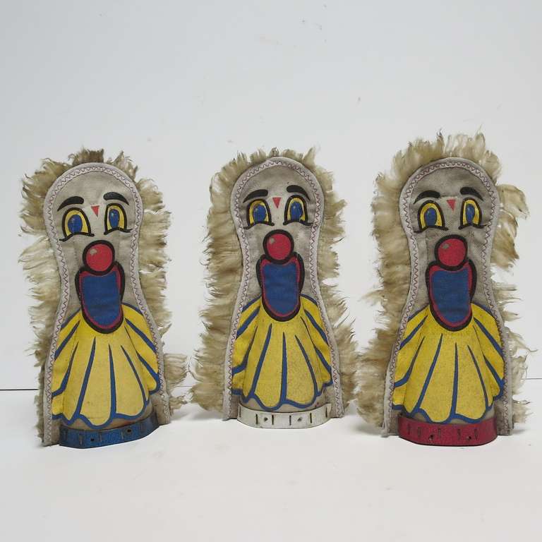 Who can forget the thrill of spending all your hard earned money to knock these clowns down to win a prize at the carnival?   The clowns are made of a thick canvas, painted on both sides, and mounted onto thick wooden bases. The edges are complete