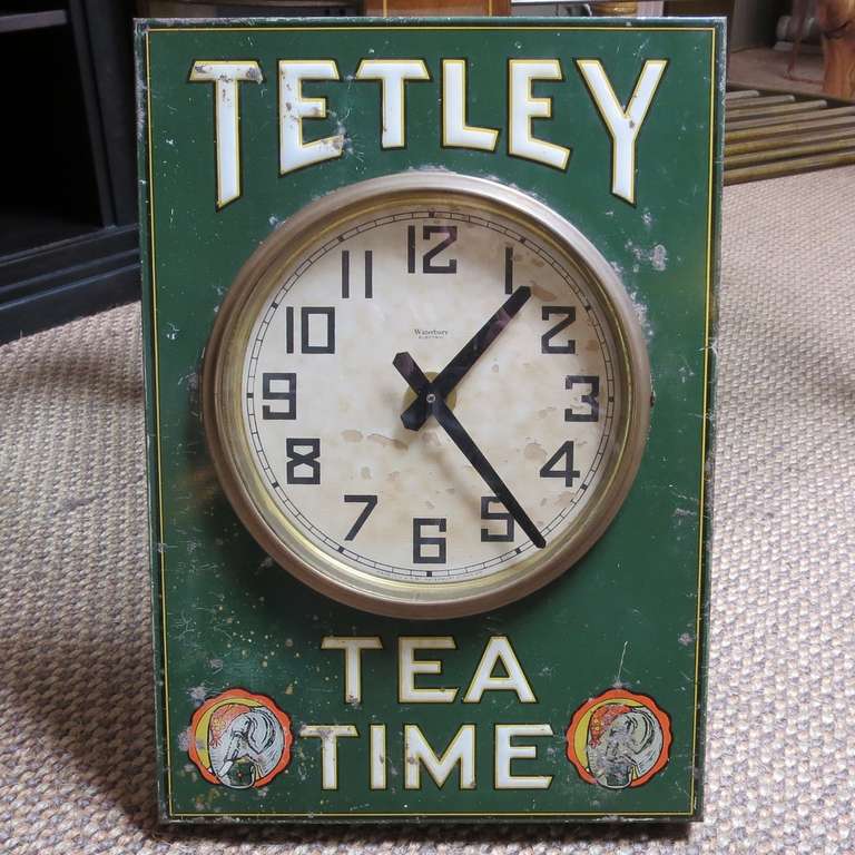 This charming embossed tin clock once graced the walls of a market selling Tetley Teas.  The small tea company is no longer with us, and this example dates back to the 1930's. It is of interest that they used circus elephants in the advertising on