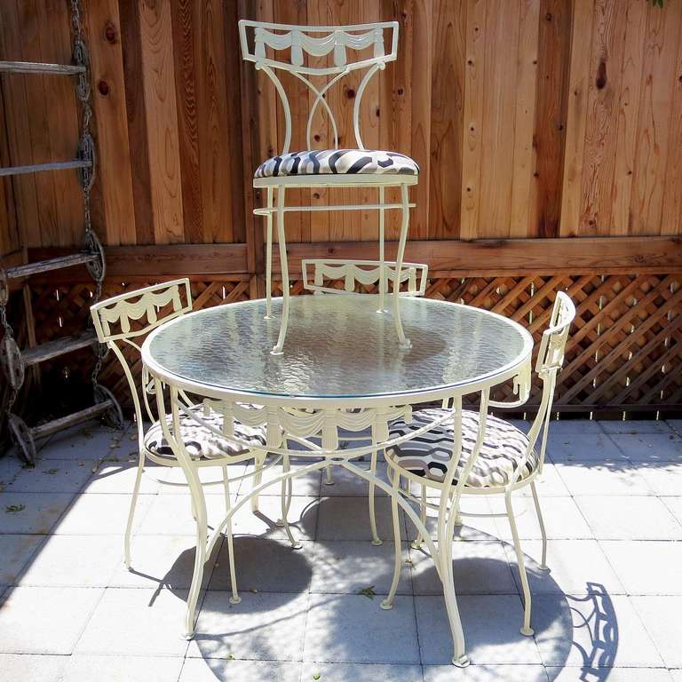 This great set came out of a local Beverly Hills estate, purchased new in the 1950's. The draped details are amazing! We have re-sprayed the metalwork, and recovered the seats in an outdoor awning fabric, and it looks great! The  top is the original