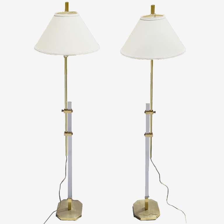 A lovely pair by unknown designer, These lamps have a unique function. With the twist of a knob, one can raise or lower the brass pole, bringing the lamp nearer or further from you. All brass elements have been refinished in satin clear coat, and