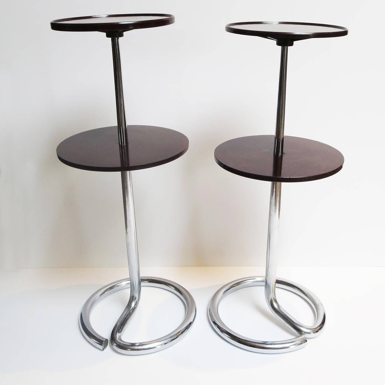This lovely pair have often been attributed to French designer Rene Herbst, but no documentation has yet substantiated this. The pair is wonderful and unique, and the perfect scale for a cocktail! The top tier measures 7 inches in diameter, while