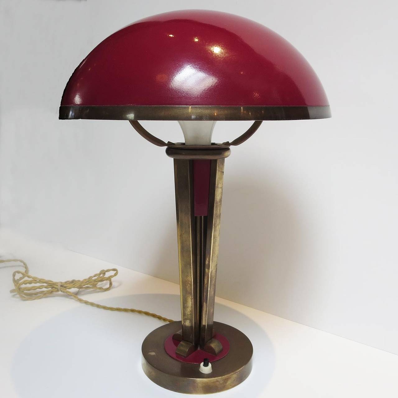 Although the designer of this great lamp has yet to be determined, the work reflects the designs of Desny and Adnet. All surfaces are original brass and enamel. The inside of the shade has been repainted in an original white color. The lamp works