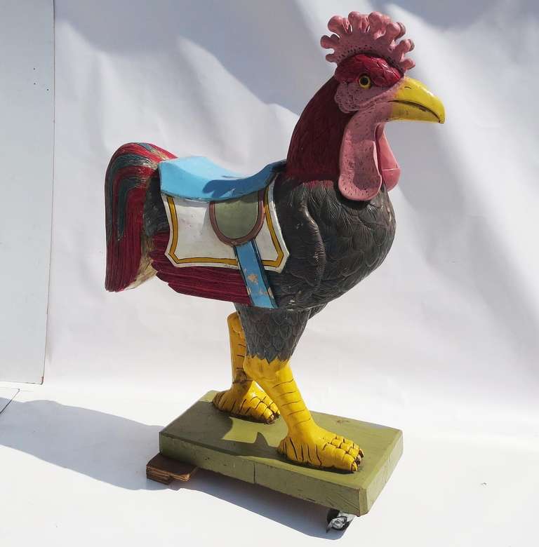 A fantastic decorative for any home or business! This solid wooden fowl is hand carved and painted, and has weathered beautifully. It is a later generational carving from the 1950's, as opposed to the late nineteenth - early twentieth century