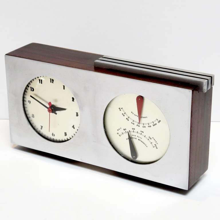 Besides all the iconic 1930s furniture designs created by Gilbert Rohde for Herman Miller, he also created a line of modernistic clocks for the company. This combination clock and barometer is a unique and wonderful design by Rohde, and one that