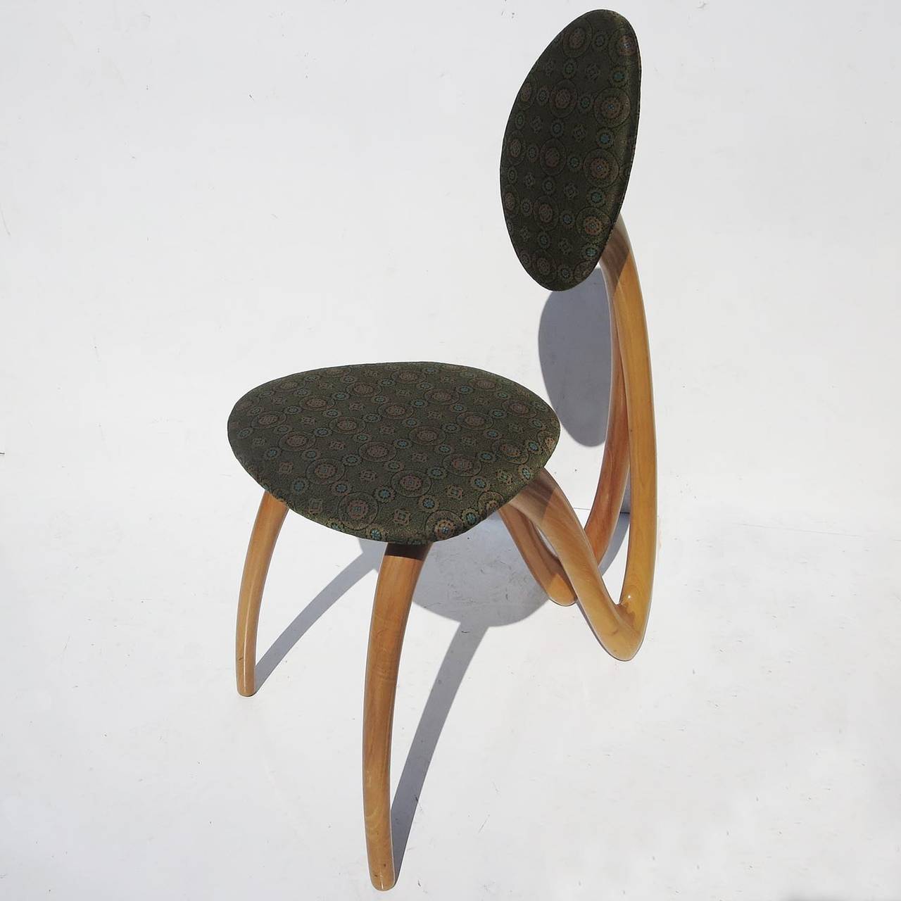 These fantastic chairs were designed by Luca and Paolo Giacomuzzi, and made in Murano, Italy for the Chestnut Design Crew. The sensually amorphic design is both pleasing and comfortable. The frames are made of sculpted and finished chestnut. All