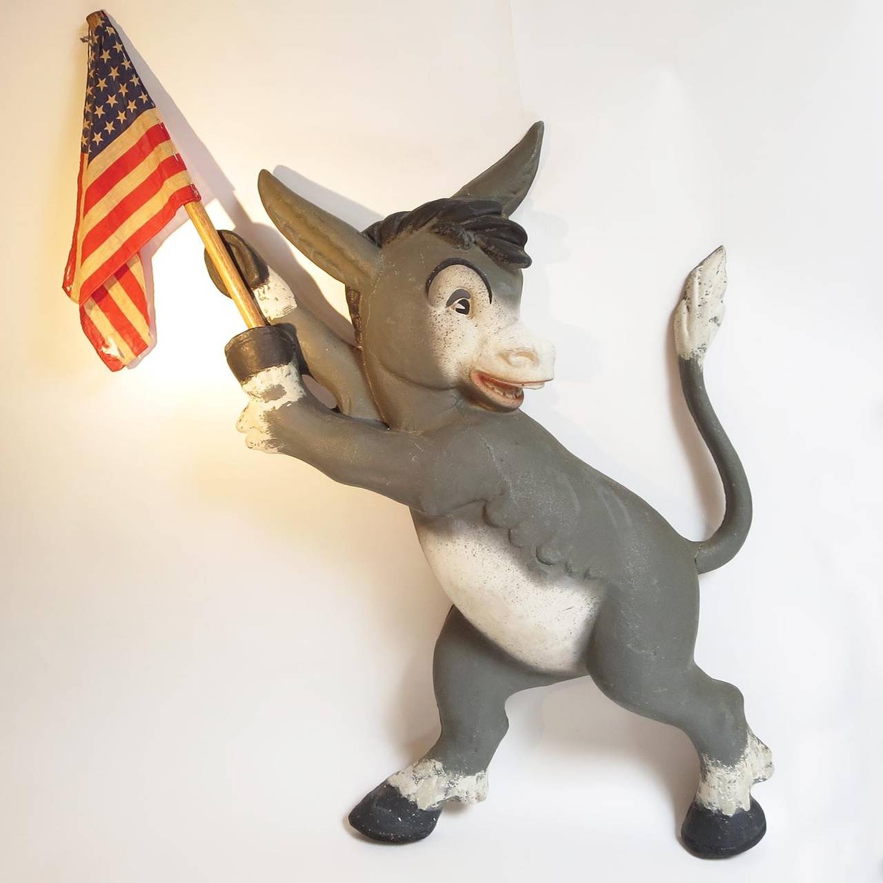 This charming pair of wall hangings each sport a 48 star flag, putting them into the 1950's or earlier. The donkey and elephant are both constructed of painted papier mache, and look fantastic! They could have been used in separate political