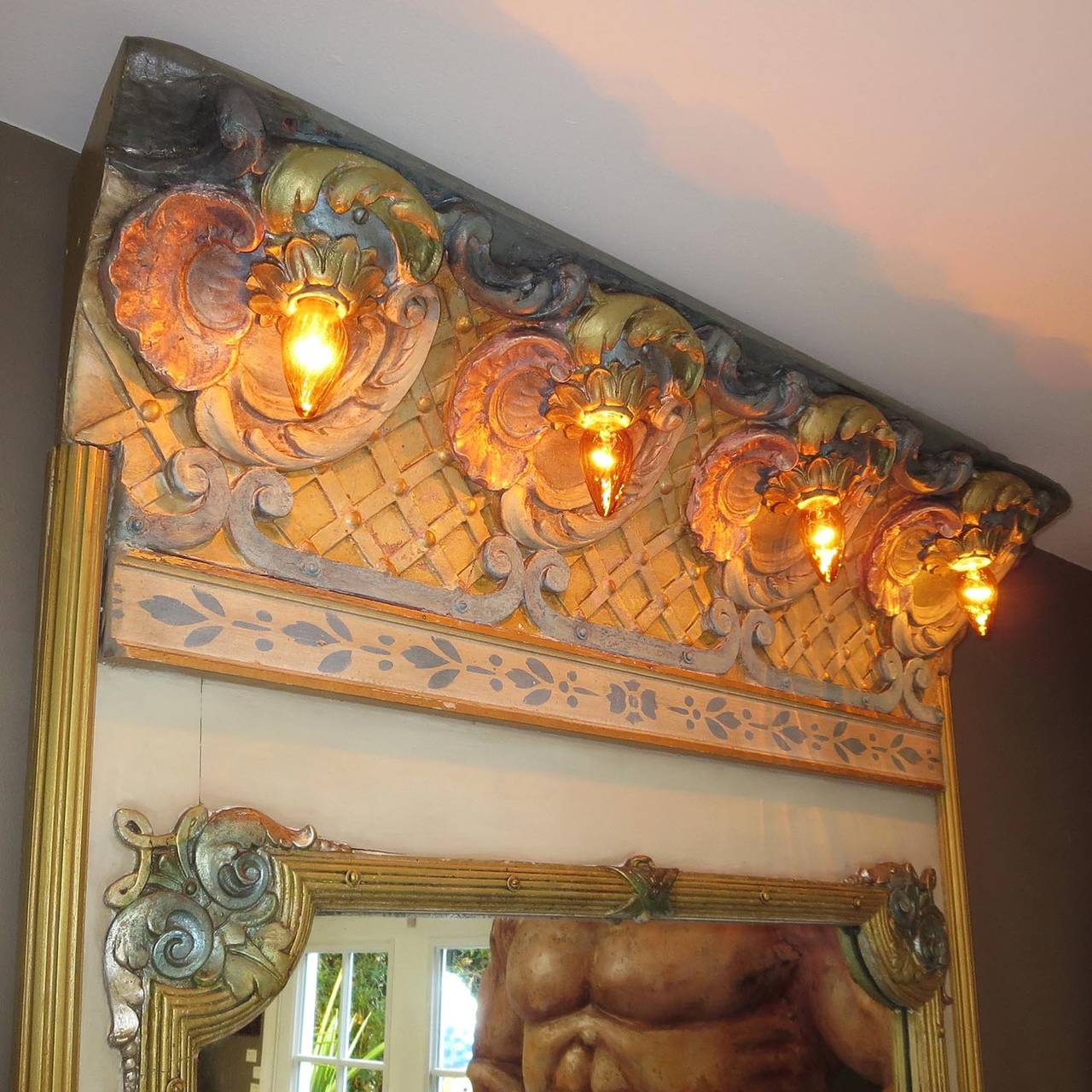 This fantastic lighted mirror was once part of the inner circle of a Dentzel carousel from Coney Island, New York. Dentzel was considered one of the very finest of the carousel makers in America, with the most beautiful and elaborately carved