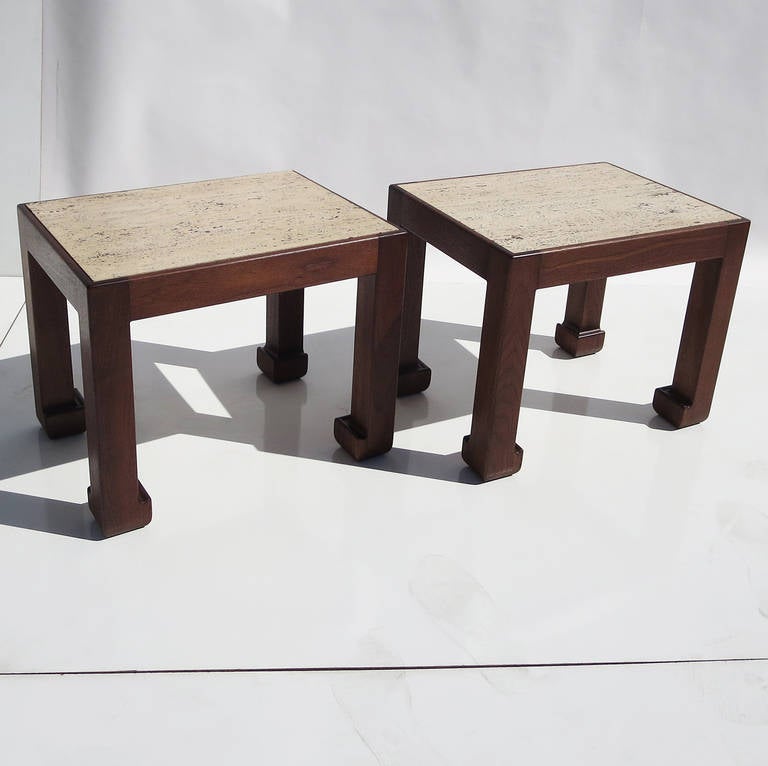 A lovely pair of tables by unknown designer A. Liardet. The tables are solid walnut, with inset tops of travertine marble. We have refinished the wood in a satin finish, and they look fantastic! Both tables feature a pleasing stylized foot, and wood