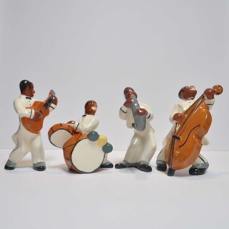 This stylized and whimsical quartet was created by the Brayton Laguna Pottery Company of California in the 1940's. Brayton was well known for creating Negro 