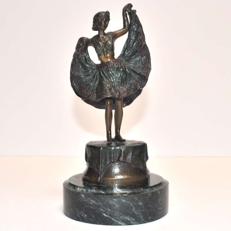 This lovely cold painted bronze dancer was created by the Austrian artist, Bergman. Because of prevalent anti-semitism rampant throughout Europe at the time, he disguised his name to spell Namgreb, which was Bergman in reverse. She is a mechanical