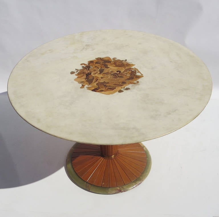 This is certainly one of the most unbelievable tables we have seen! The parchment top is inlaid with a crazy scene of a royal court going berserk, while a frustrated king gazes on. The table top has a gently sloping bevel on the underside, adding a