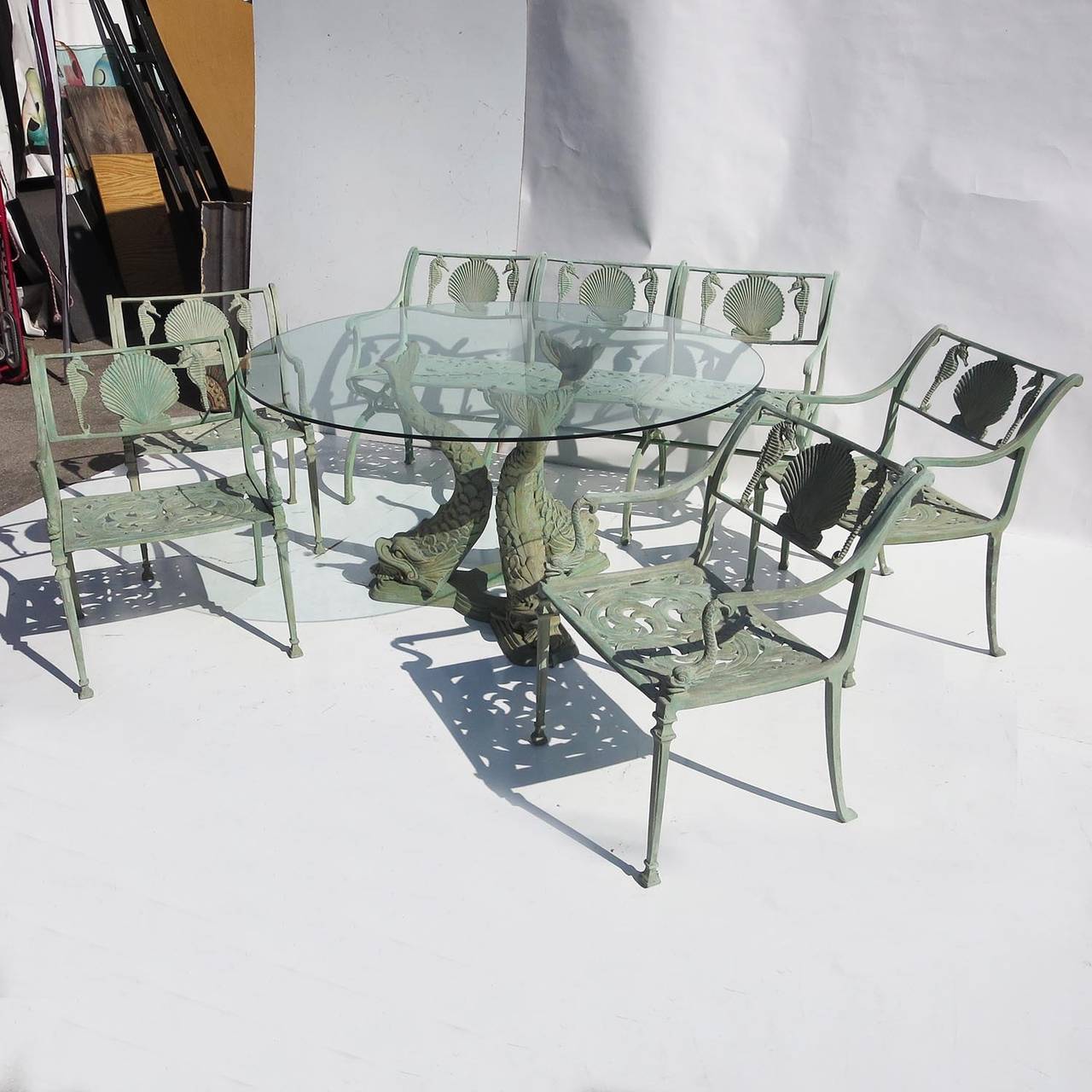 The ultimate patio setting for a balmy evening in the Hamptons! Created by the Molla Furniture Company in New York City in the 1940s. Cast aluminum was utilized to prevent any deterioration of rust, and the furniture was painted in a sage green