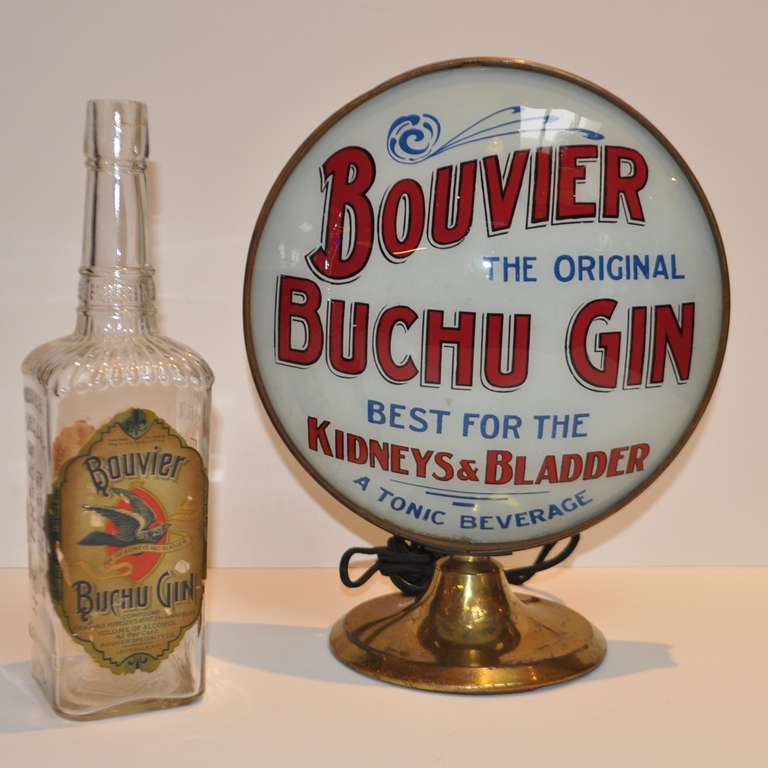 In the great tradition of quack medicine, early Buchu Gin was claimed to cure kidney and bladder ailments. The reality was, after drinking a bottle, you forgot all about your kidney and bladder! This wonderful and rare domed glass advertising lamp