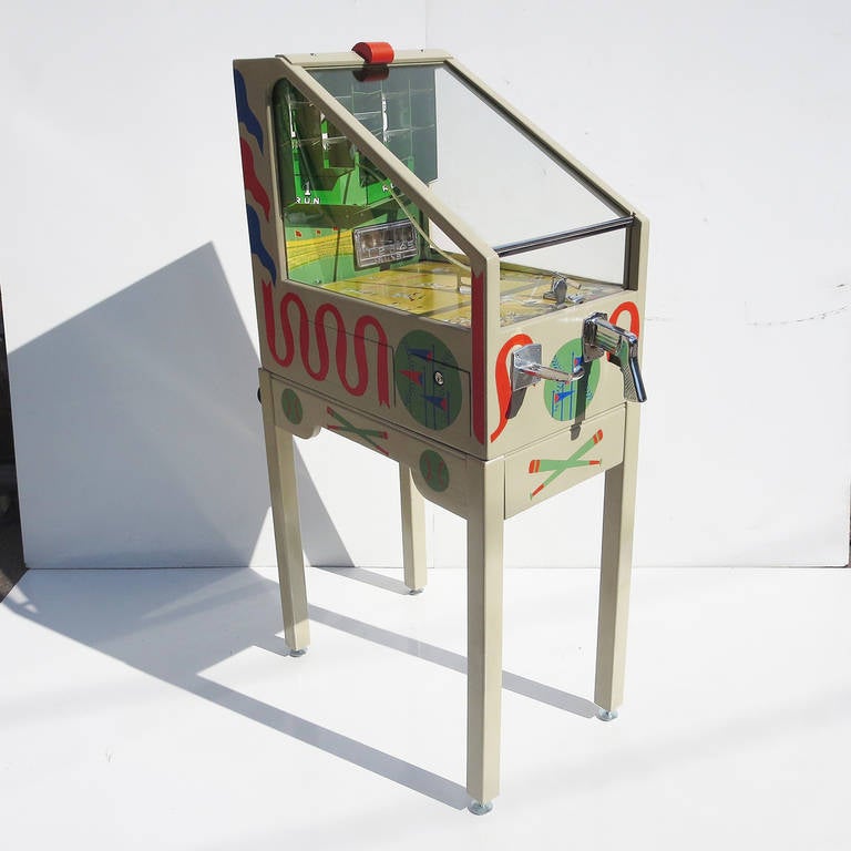 This rare game was manufactured by the J.H. Keeney company of Chicago, Illinois in 1941. Perhaps because of the war, or the petite scale of the machine, very few were ever produced. But what a game! This electro mechanical game has a very unique