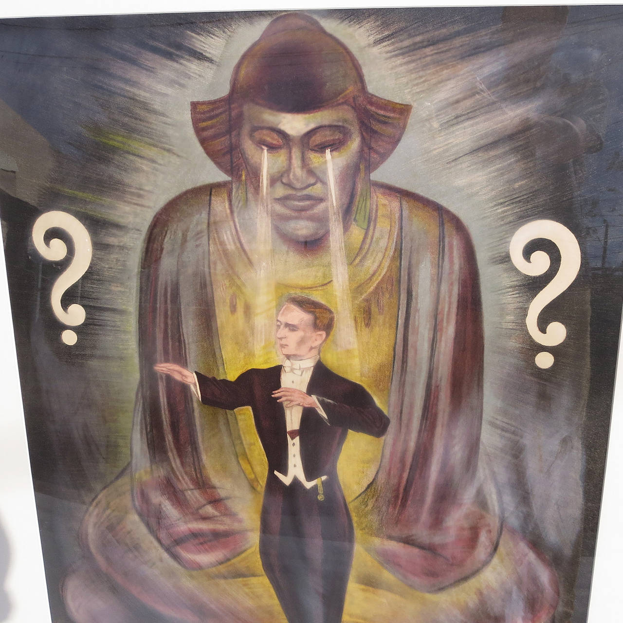 A very captivating image of a solo magician in the fixed gaze of a Buddha - like figure. The mystery is compounded by the pair of question marks on either side. The poster is done in a stone lithograph form, more commonly used in the late 19th -