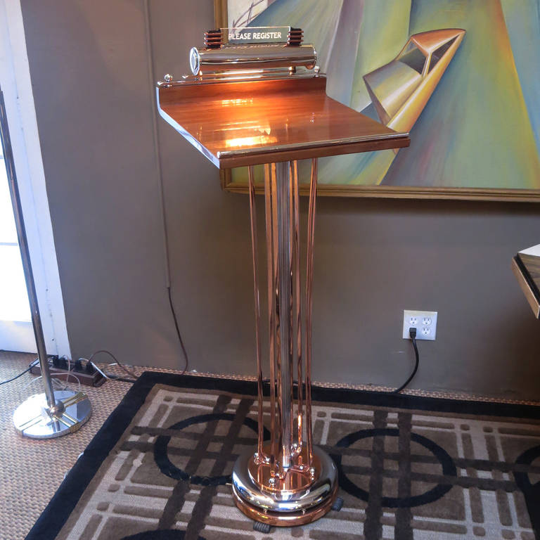 An incredibly glamorous stand in fully restored condition, this beauty will make a great first impression on everyone entering your home or place of business. All the copper and chrome elements have been re-plated, the wooden top has been