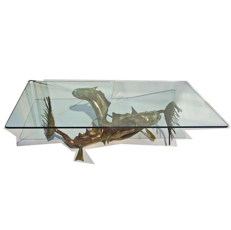 RETIREMENT SALE!!!  EVERYTHING MUST GO - CHECK OUT OUR OTHER ITEMS.				

Designed in France in the 1980's, this striking table is the ultimate in fantasy seaside decor! A pair of intertwined metallic sea creatures form the base for a heavy polished