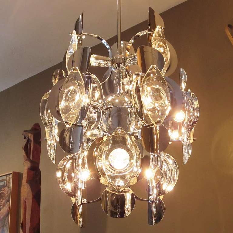 A stunning design by Sciolari, this version is slightly smaller in diameter than the 15 light version we are also showing. The chrome and crystal elements are in excellent condition, and the lamp displays beautifully. The crystal elements are