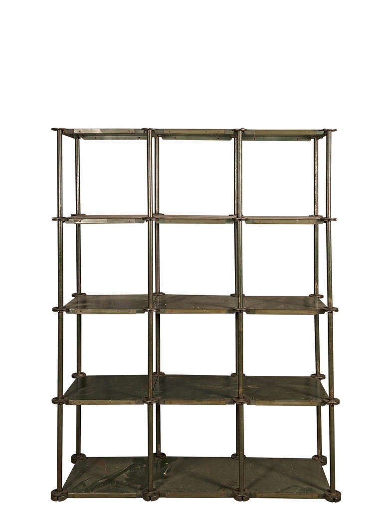 Steel shelving unit in three segments with five shelves.