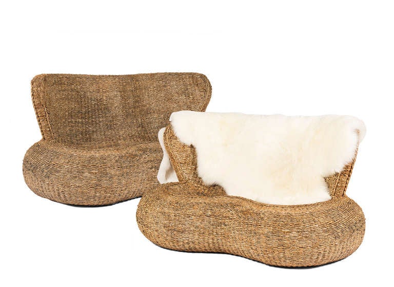 Rattan sette with rounded front double seat and high back. Fur throw sold separately.

ONE LEFT