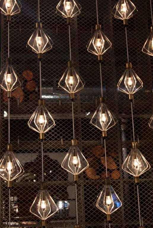 symmetrical plexi snowflake lights<br />
strung up and down vertical wire each string at staggered lengths,65 lights total