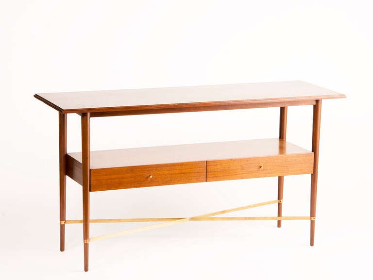 Mahogany two-tiered console table, two drawers on tapering legs with brass x-form banded stretchers.