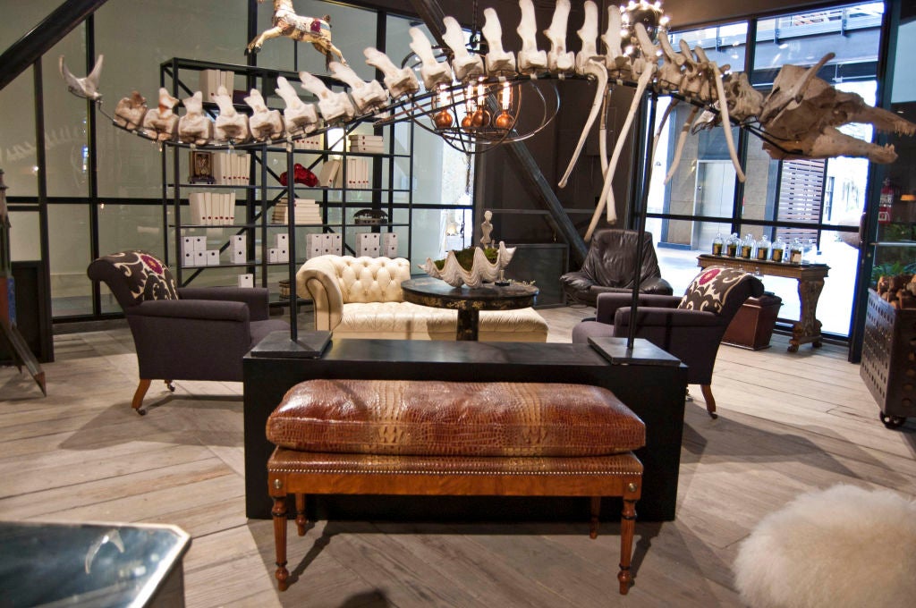 Traditional empire wood frame construction, apron brass mounts resting on fluted legs with ebonized ring details on toupie feet newly upholstered semi-attached cushion in faux alligator.