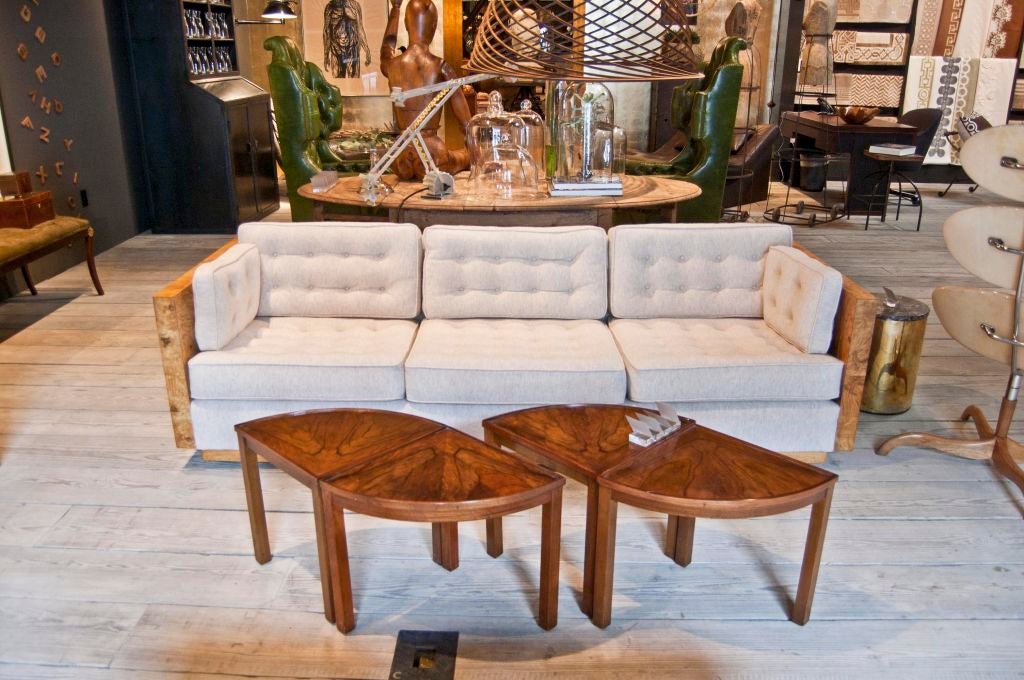 A stunning three seater sofa designed by Milo Baughman for Thayer Coggin. Newly upholstered Holland & Sherry boiled wool chamonix encased by book-matched olive wood veneer wood frame, features eight loose rectangular form cushions, and concealed