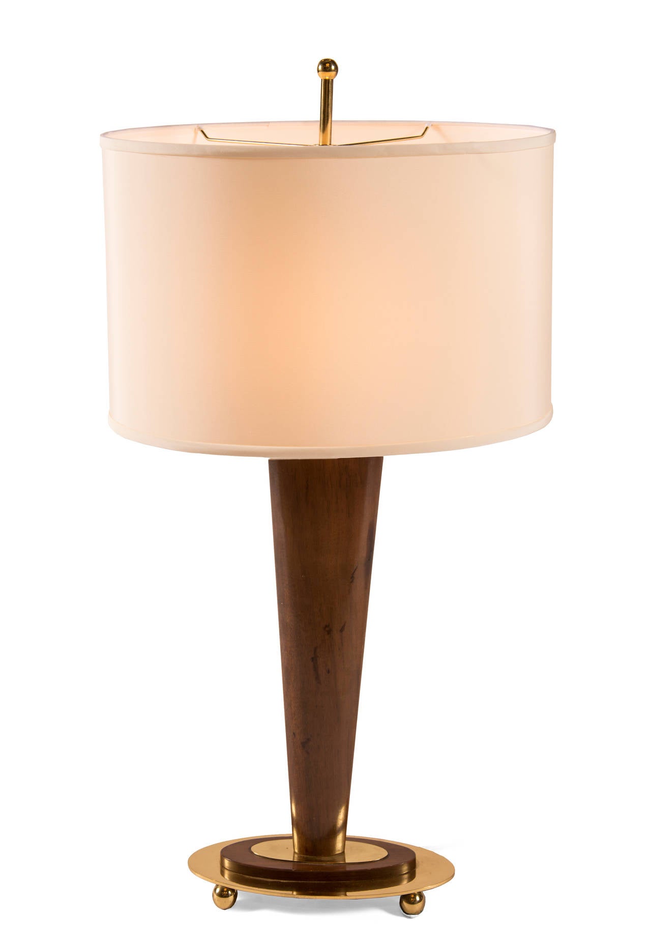 Single wooden oval and tapered table lamp on polished brass base with brass ball feet. Matching polished brass finial. Shade sold separately.

* There is only one lamp left, price is for one *
