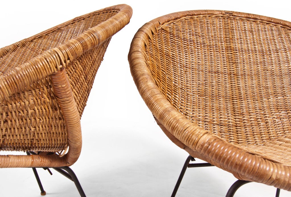 Pair of steel rod frames hand woven conical form wicker seat. Retains original brass caps on four splayed legs.