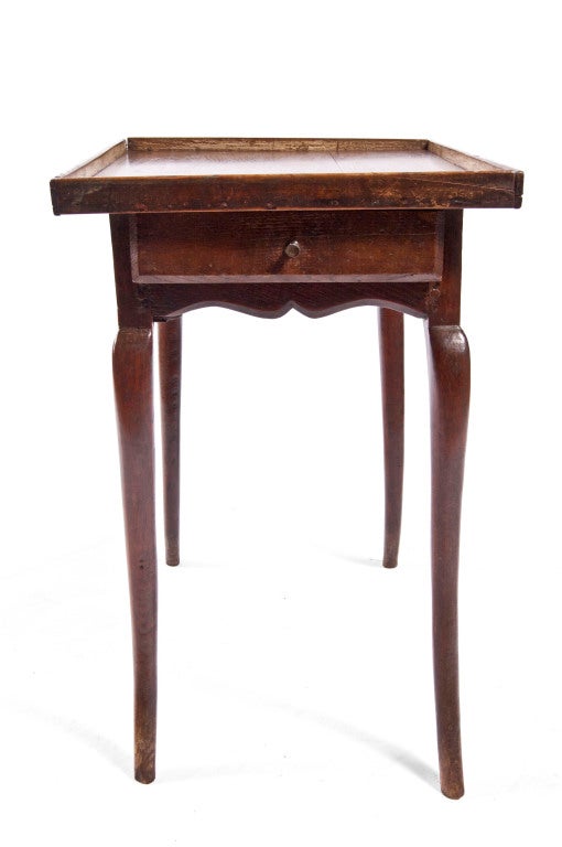French provincial oak side table with  cabriole legs and single drawer.
